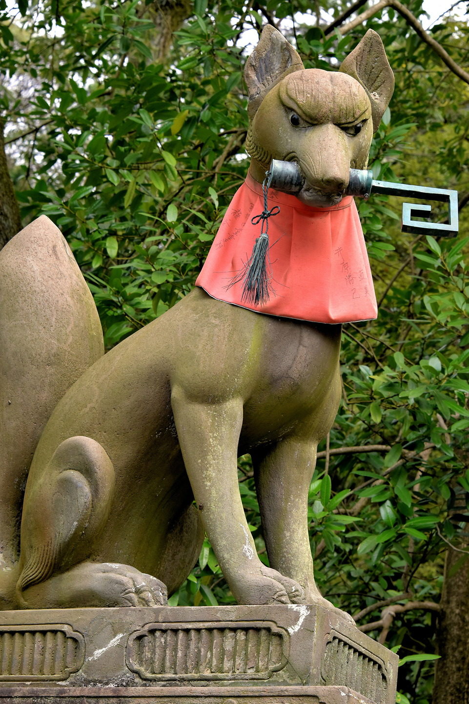 A stone fox statue (Kitsune) at Fushimi Inari Taisha