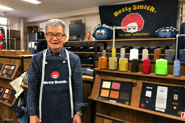 Betty Smith Ebisu Workshop with teal rivet machines and jeans on display