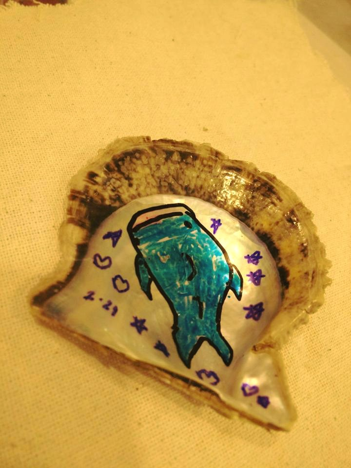 Child's drawing on an oyster shell