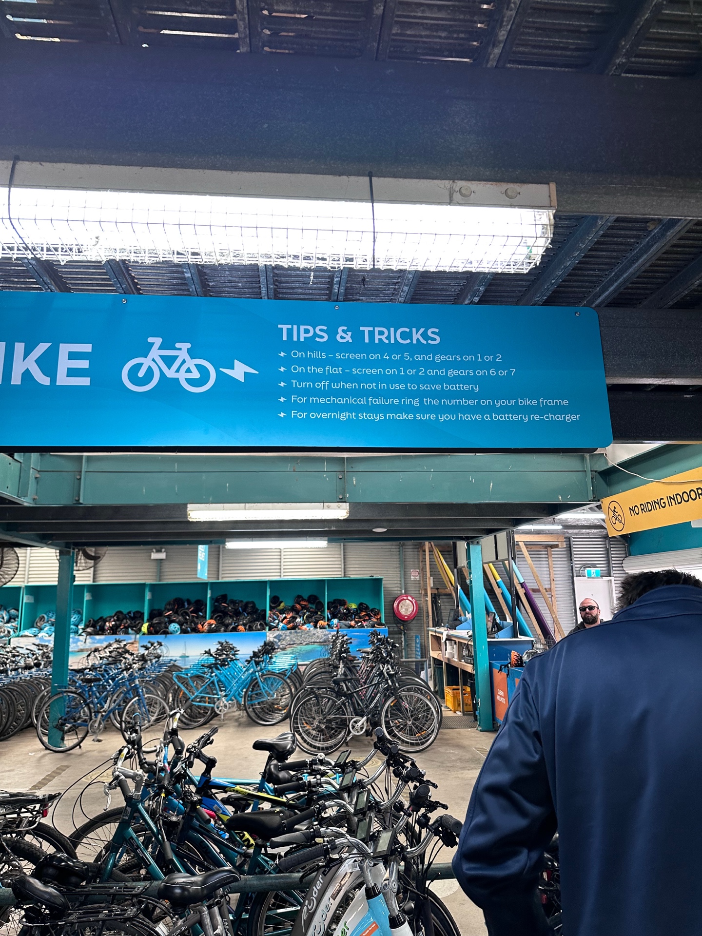 Rottnest Island bike rental shop with tips and tricks sign