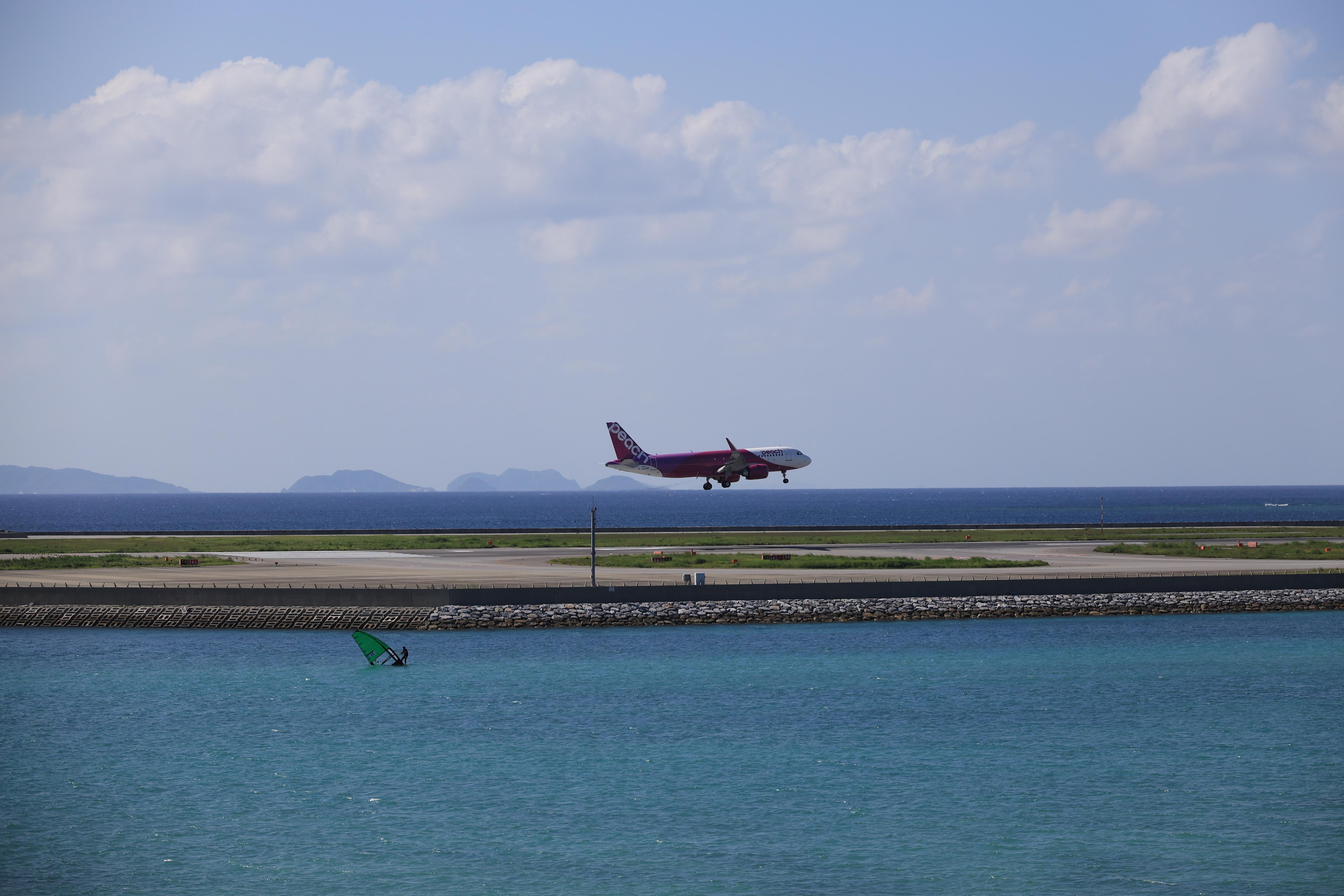 Peach Aviation plane and windsurfer