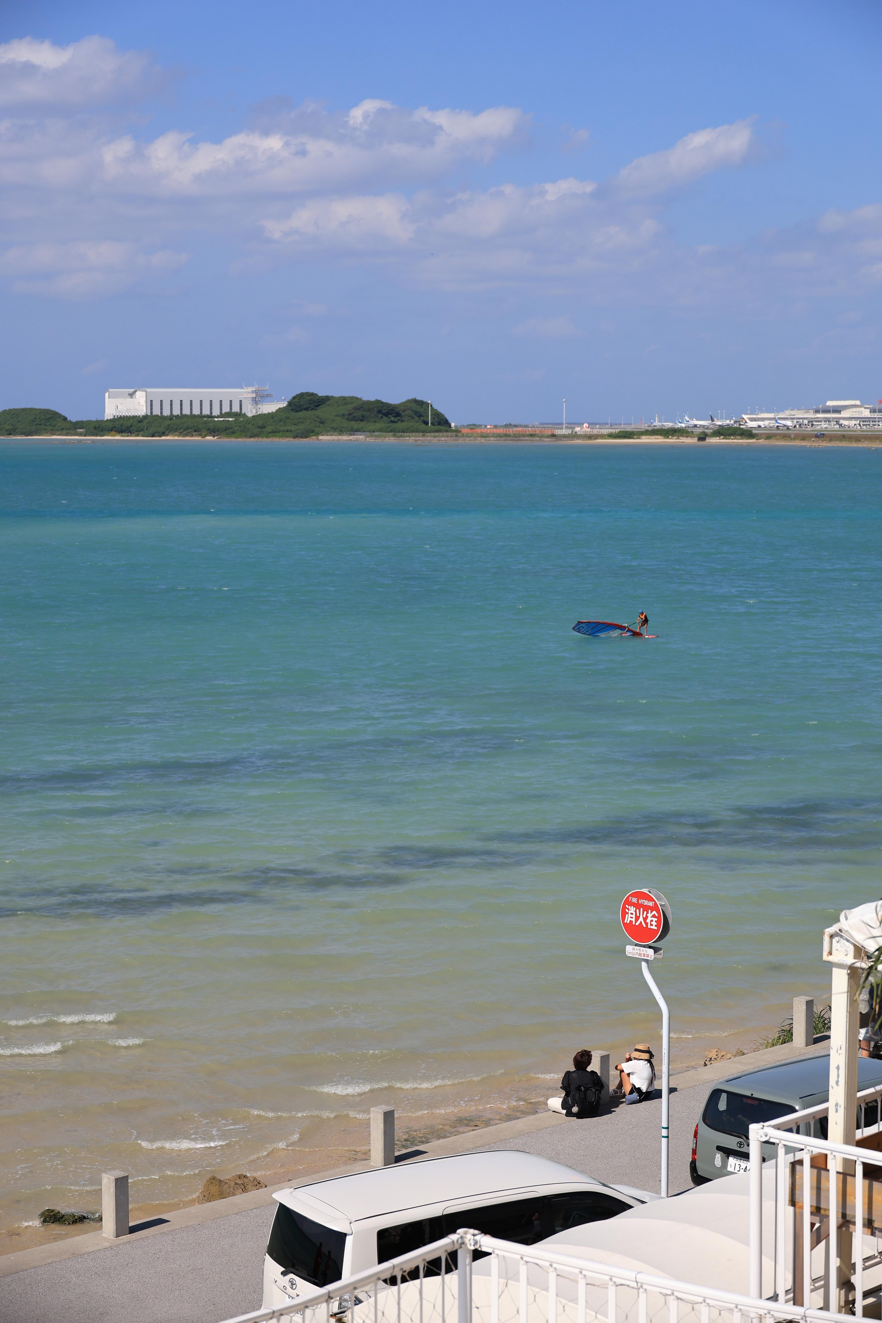 Wide view of the sea and windsurfer