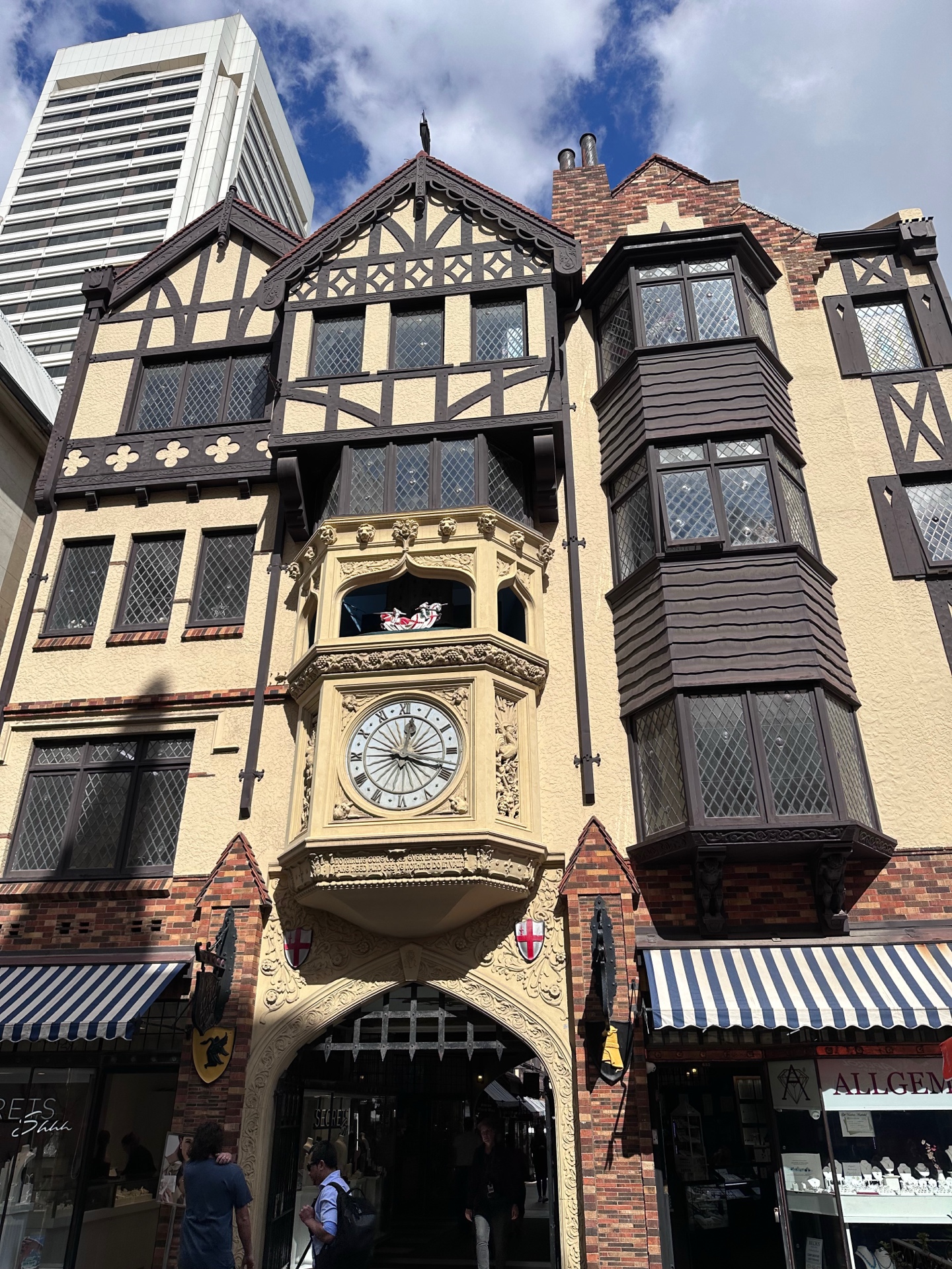 Close-up of the London Court Hay Street clock tower with ornate Tudor carvings